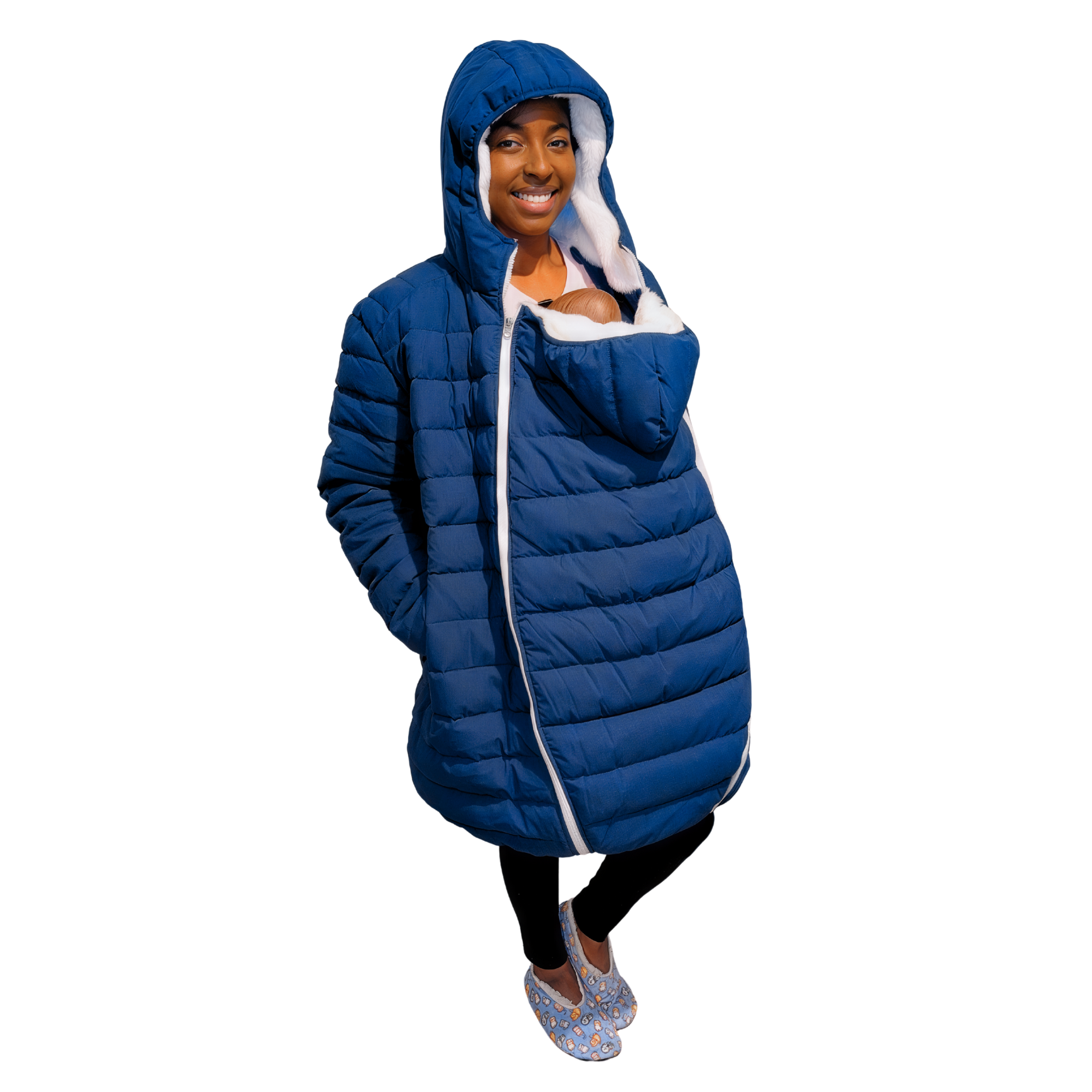 Person wearing a blue puffer babywearing overcoat jacket with a baby insert covered with a hood in an indoor setting